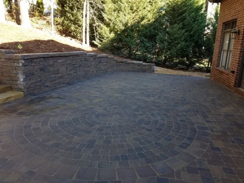 Drainage landscape paving, outdoor patio design, stone paver patio, backyard landscape architecture, John Russell landscape architect, stonework outdoor living, modern landscape design, custom patio paving, hardscape landscaping, professional landscape paving contractor.