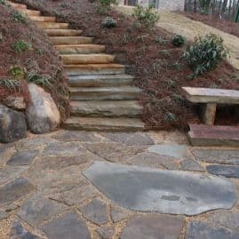 Natural stone staircase and pathway design by John Russell Landscape Architect for elegant outdoor landscape solutions.