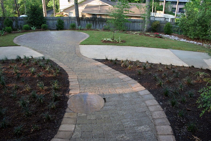 Bricked walkway landscape design in backyard by John Russell Landscape Architect.